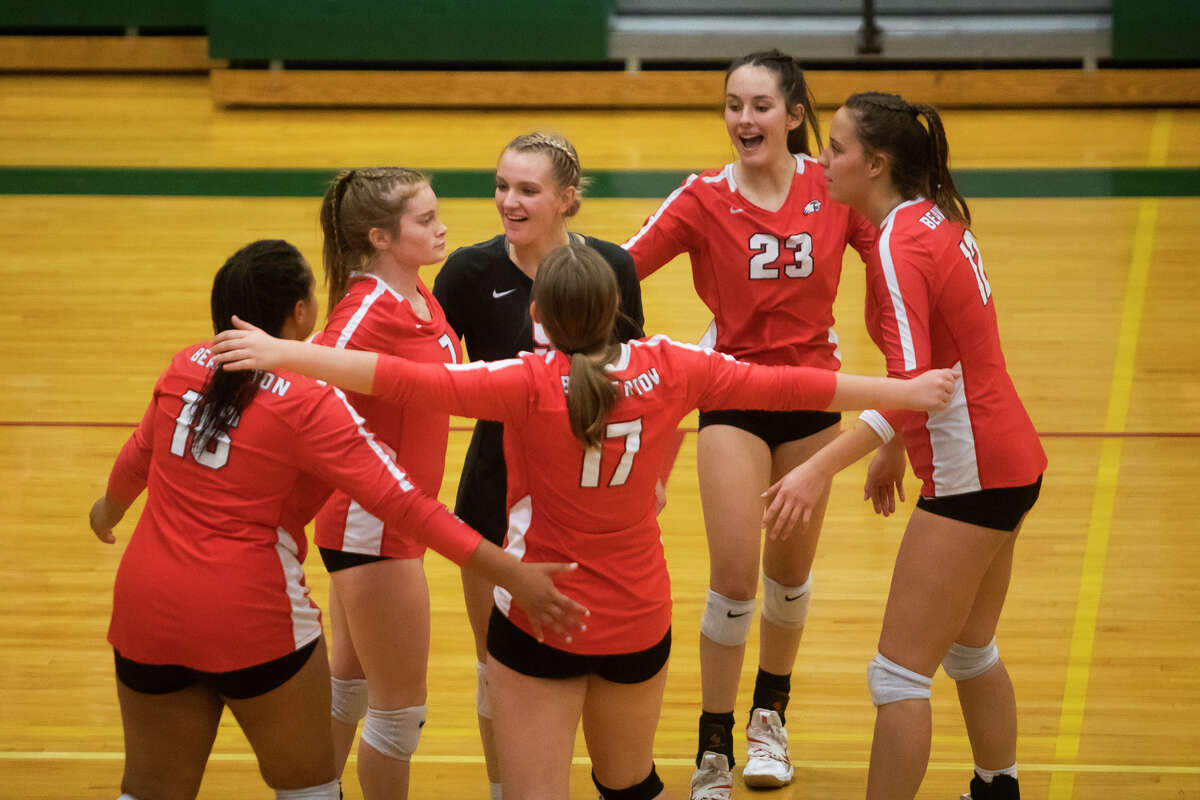 Beaverton players celebrate a point during their regional semifinal victory over Tawas Tuesday, Nov. 9, 2021 at Houghton Lake High School. (Katy Kildee/Midland Daily News)