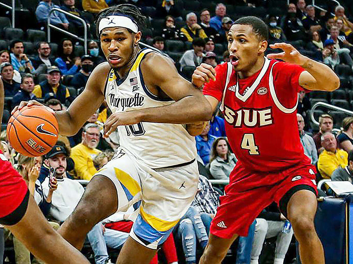 Marquette University's Justin Lewis, left, drives against SIUE's Shamar Wright in Tuesday night's 88-77 Marquette win in Milwaukee.