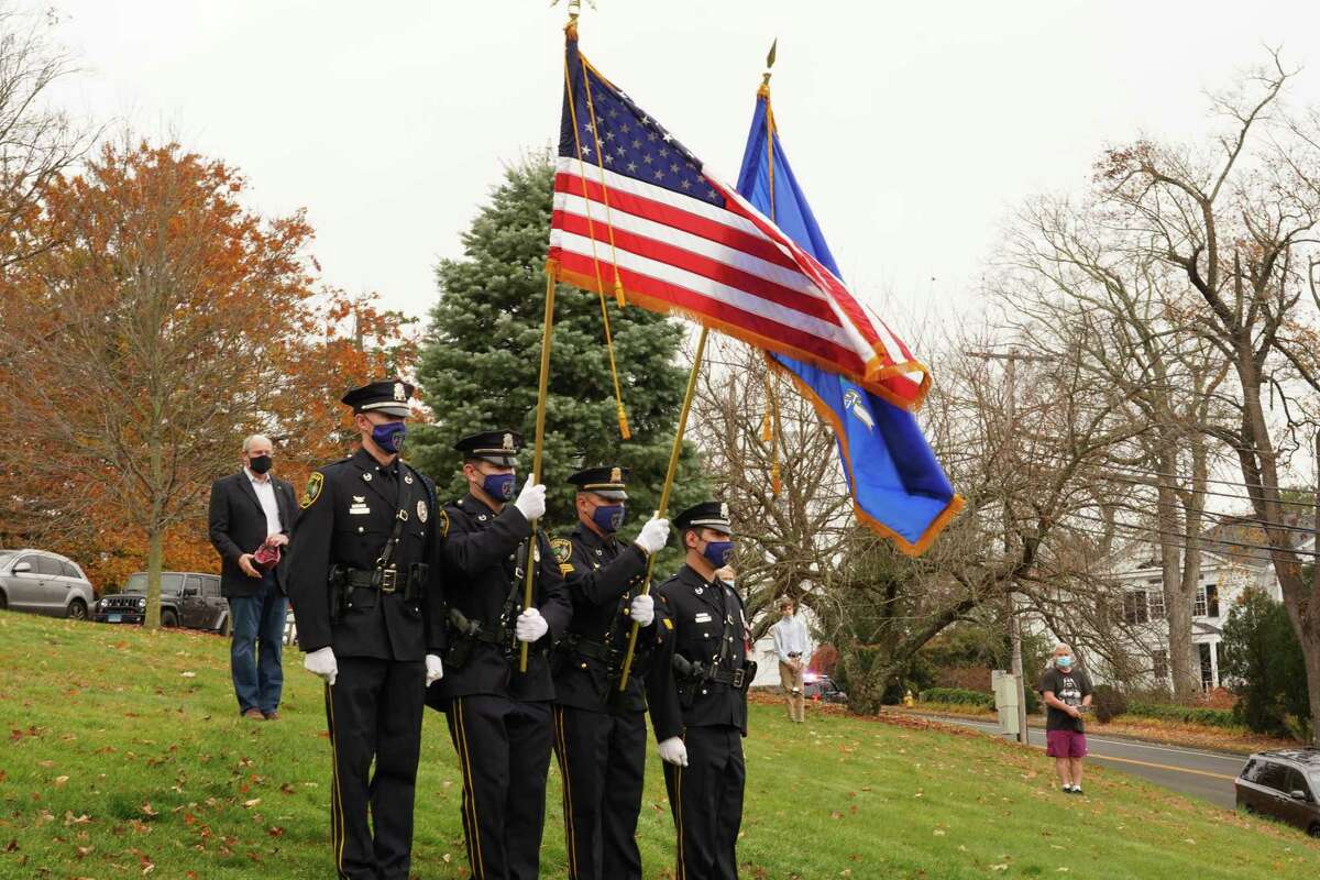 The New Canaan Police Department served as color guard for the Veterans Day ceremony in God's Acre in New Canaan on Nov. 11, 2020.