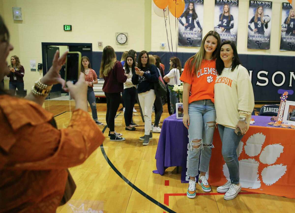Senior Isabella Kerr (left) and her mother, Tanya, pose for a photo as 14 Smithson Valley students gathered with classmates to celebrate college signing day on Wednesday, Nov. 10, 2021. Though Kerr played volleyball for Smithson Valley, she accepted a scholarship to Clemson for rowing.