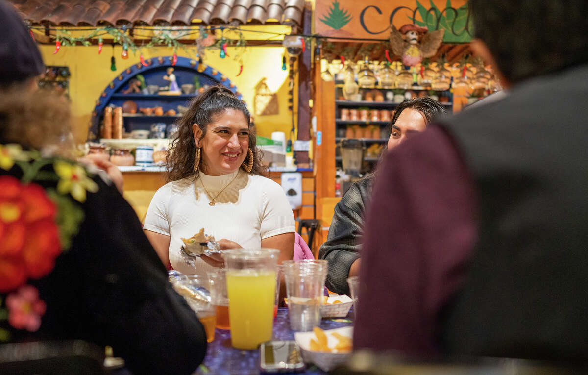 Cecilia Peña-Govea eats with her family in the dining room of El Metate, in San Francisco's Mission District, on Thursday, Nov. 3.