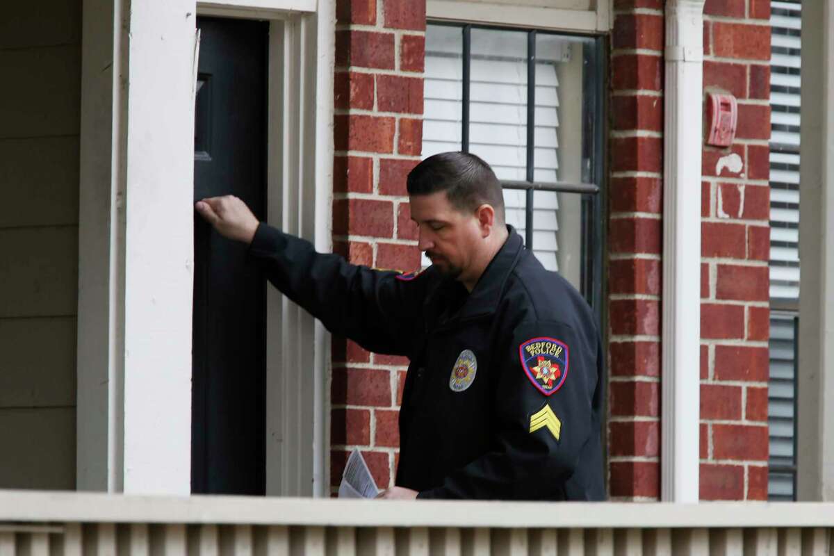 Sgt. Tyler Stillman of the Bedford Police Department knocks on the door of a domestic assault suspect, intending to hand over a letter warning that police are watching. "If they do have anything to say, it's usually 'Thank you.'"