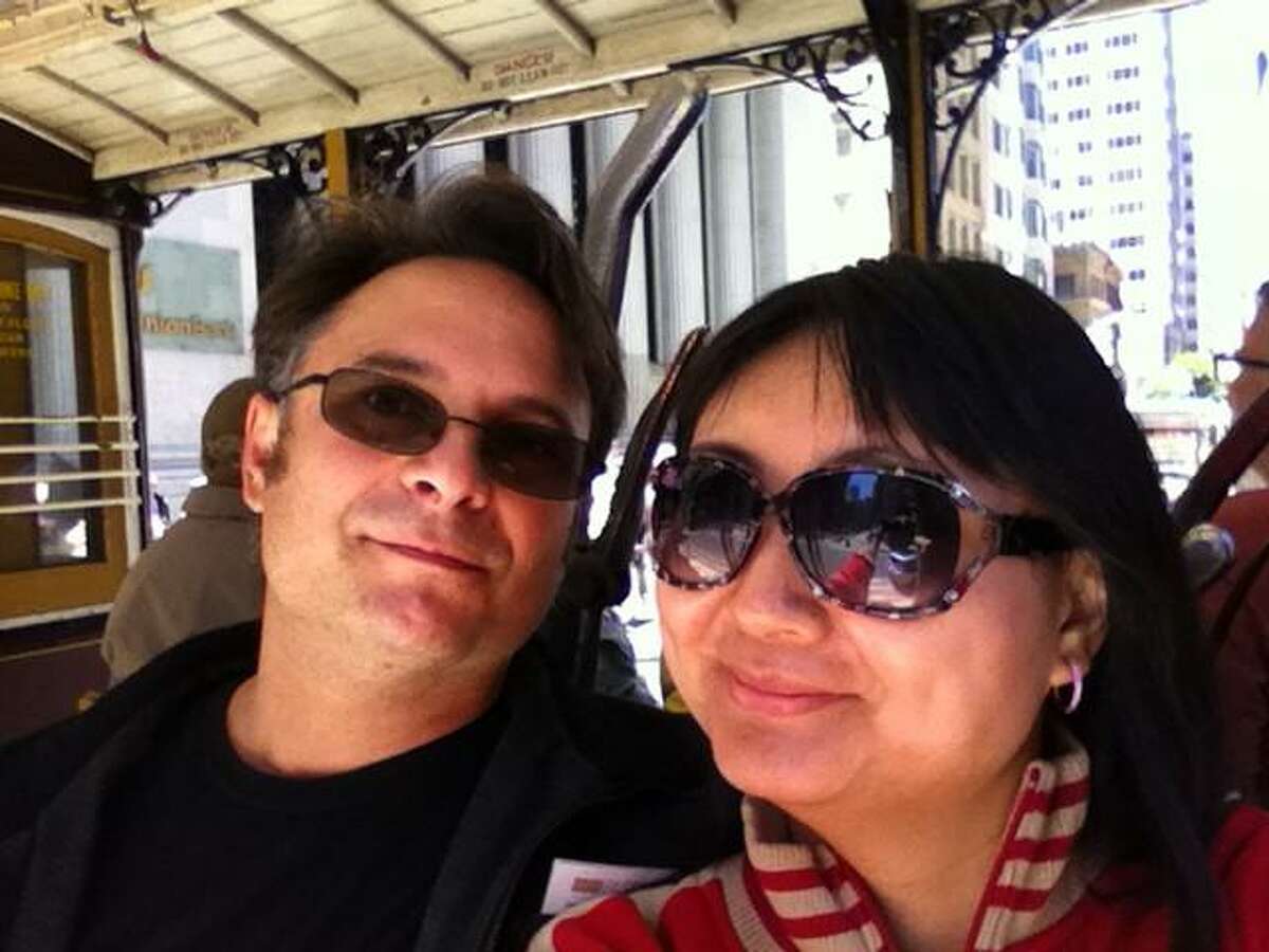 Manny and Sherry Garcia ride the cable car during their honeymoon in San Francisco in August 2013.