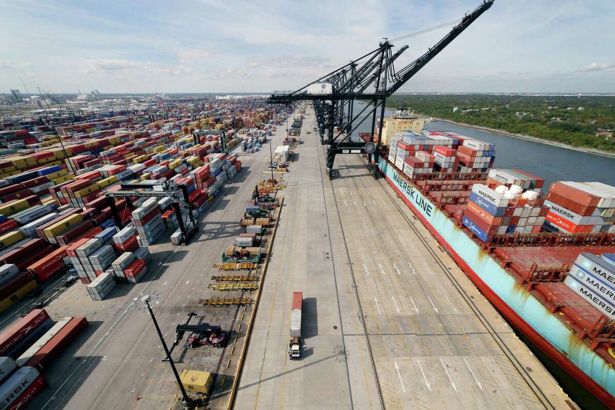 A wide angle view looking west from atop the eastern most ship-to-shore crane with stacks of inbound and outbound shipping containers, left, and other STS cranes loading the cargo ship Maersk Chicago, right, at the Bayport Terminal at the Port of Houston Authority Tuesday, Nov. 9, 2021 in Seabrook, TX.