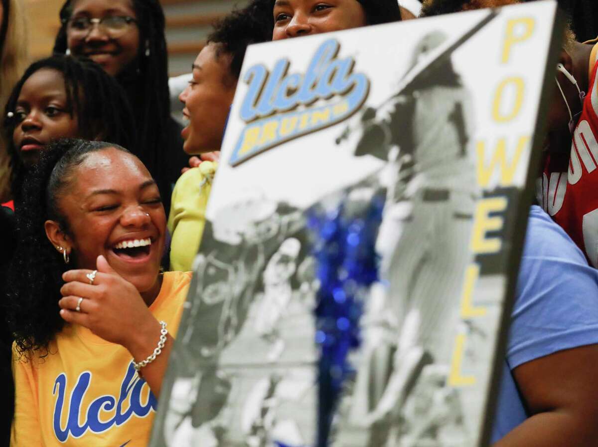 Conroe’s Kennedy Powell laughs as she visits with friends and family after signing to play softball for UCLA during a signing ceremony at Conroe High School, Wednesday, Nov. 10, 2021, in Conroe.