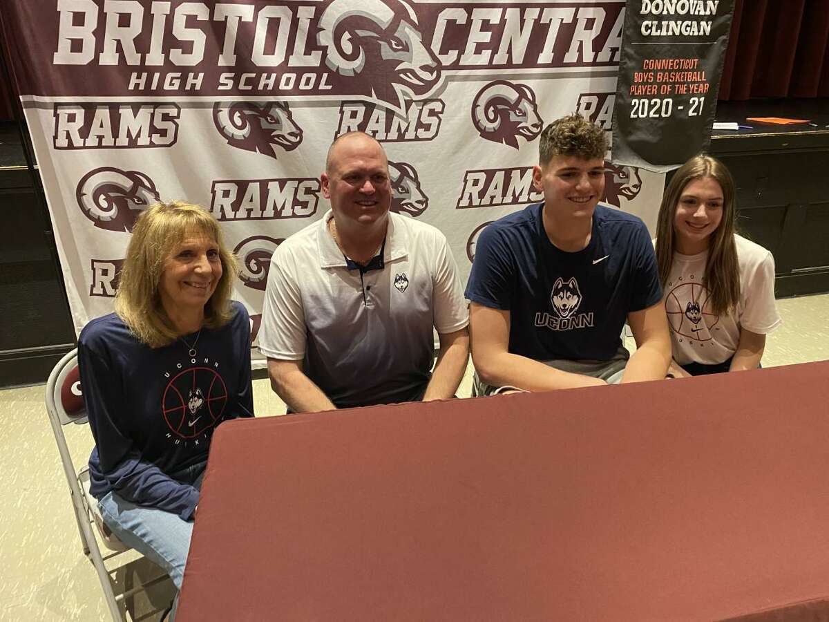Bristol Central 7-footer Donovan Clingan (second from right) is all smiles after signing his national letter of intent to attend UConn, while flanked by (left to right) his grandmother, Debbie Porrini, his father, Bill, and his sister, Olivia.