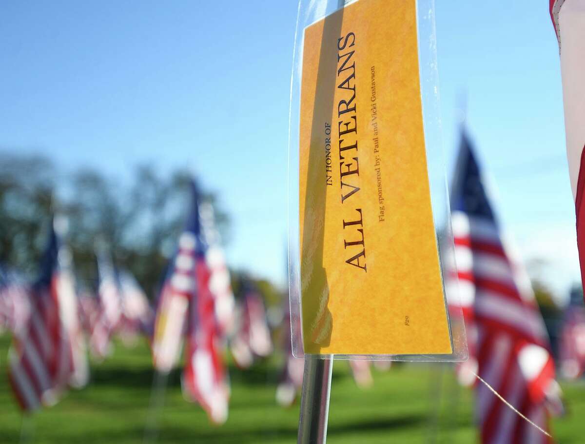American flags are tagged honoring veterans at the Kiwanis Club of Fairfield's 5th annual Field of Honor display at Jennings Park in Fairfield, Conn. on Saturday, November 6, 2021.