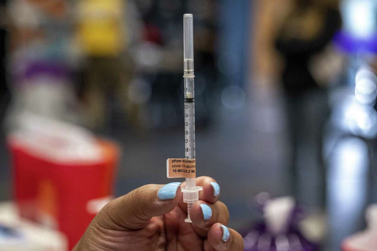 A syringe with a pediatric dose of the Pfizer-BioNTech Covid-19 vaccine at a vaccination clinic at an elementary school in San Jose, California, U.S., on Thursday, Nov. 4, 2021. Younger children, ages 5 to 11-year-old, across the U.S. are now eligible to receive Pfizer Inc.'s Covid-19 vaccine, after the head of the Centers for Disease Control and Prevention granted the final clearance needed for shots to begin. Crosby ISD is partnering with Harris County Public Health to offer free COVID-19 vaccines for children ages 5 to 11 at an upcoming clinic. The dates and times are: Friday, November 12, 10 a.m. - 6 p.m. and Saturday, November 13, 10 a.m. - 6 p.m. The clinic will be located at Crosby Elementary School, 14705 FM 2100, Crosby, TX 77532.
