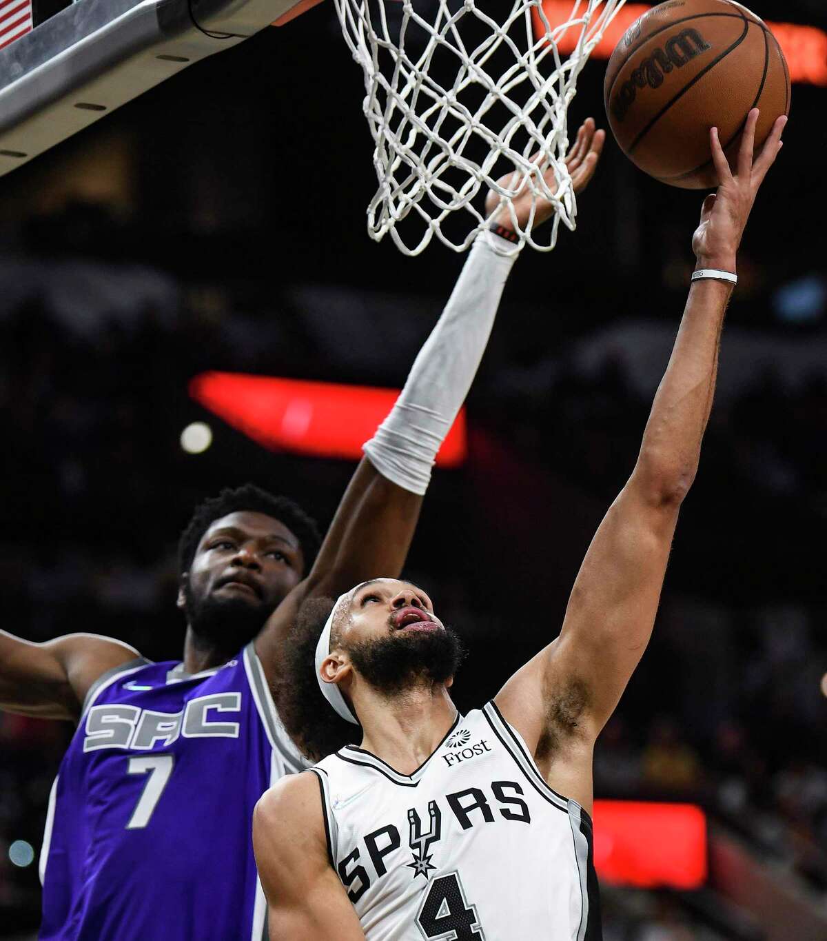 Derrick White (4) of the San Antonio Spurs shoots against Chimezie Metu of the Sacramento Kings during NBA action in the AT&T Center on Wednesday, Nov. 10, 2021.