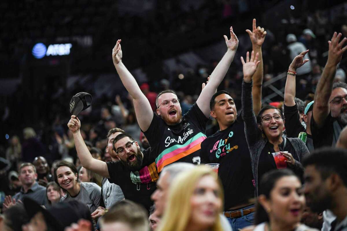 San Antonio Spurs fans show their enthusiasm during second-half NBA action against the Sacramento Kings in the AT&T Center on Wednesday, Nov. 10, 2021.