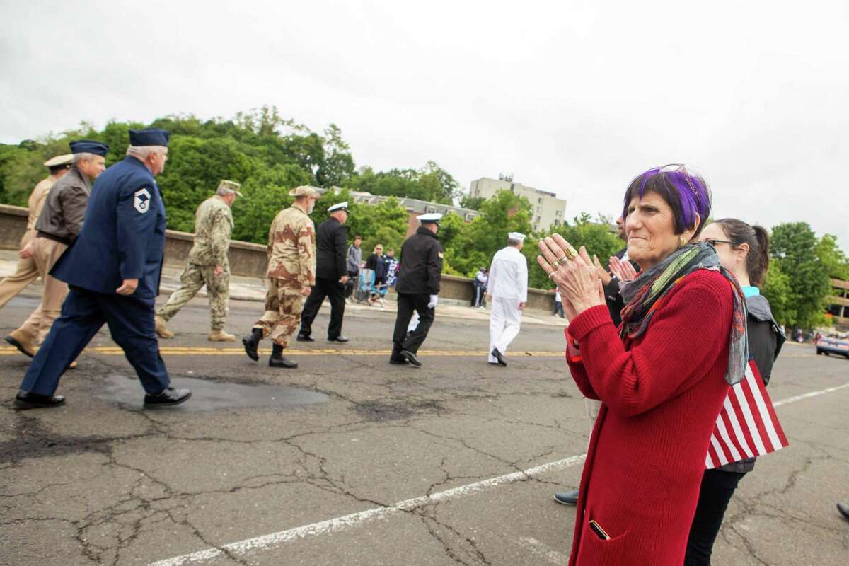 U.S. Rep. Rosa DeLauro applauds the procession of armed forces veterans during the Derby-Shelton Memorial Day Parade on May 31 2021.