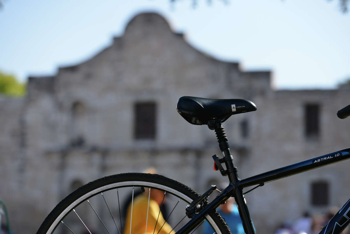 A bicycle waits for its rider in front of the Alamo. After nearly 10 years, the San Antonio Bike Shop at 1800 Broadway. will close its doors for good in December. 