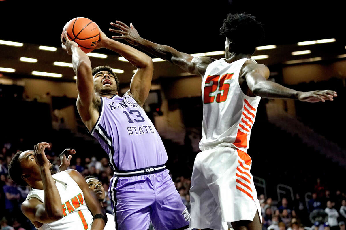Kansas State's Mark Smith (13) shoots past Florida A&M's DJ Jones (25) during the second half of an NCAA college basketball game Wednesday, Nov. 10, 2021, in Manhattan, Kan. 
