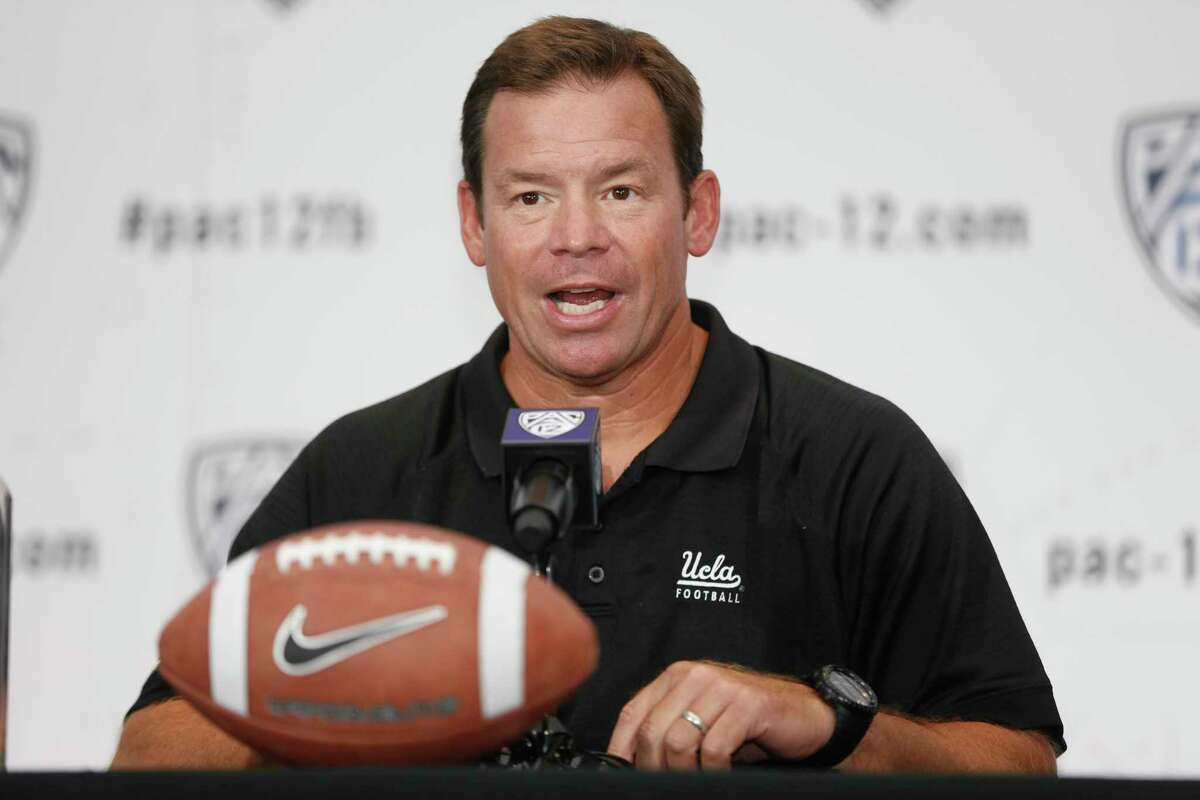 UCLA head coach Jim Mora takes questions at the PAC-12 NCAA college football media days at Paramount Studios in Los Angeles on July 24, 2014. Mora is back on the sideline as the new coach of UConn football.