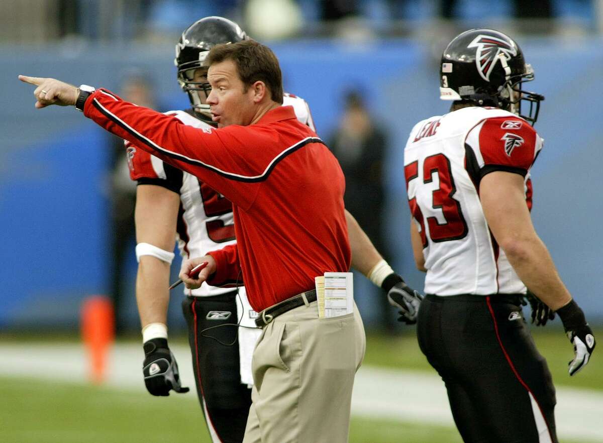 Atlanta Falcons head coach Jim Mora shouts at his players after a confrontation during the first quarter against the Carolina Panthers in Charlotte, N.C., on Dec. 4, 2005. Mora is back on the sideline as the new UConn football coach.