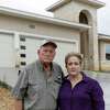 Robert and Karen Rickman stand in front of the home at 24442 Canyon Row in North Central San Antonio that they had contracted to buy. They are seeking a temporary injunction from a court to prevent the builder from selling the property to another buyer.