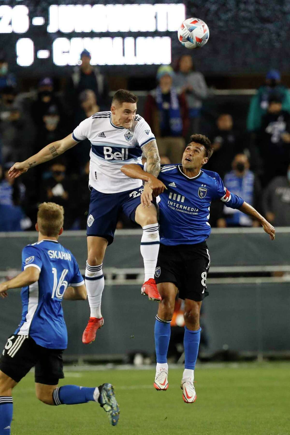 Vancouver Whitecaps defender Jake Nerwinski (28) goes up for a header against San Jose Earthquakes forward Chris Wondolowski (8) during the second half of an MLS soccer match in San Jose, Calif., Saturday, Oct. 23, 2021. (AP Photo/Josie Lepe)