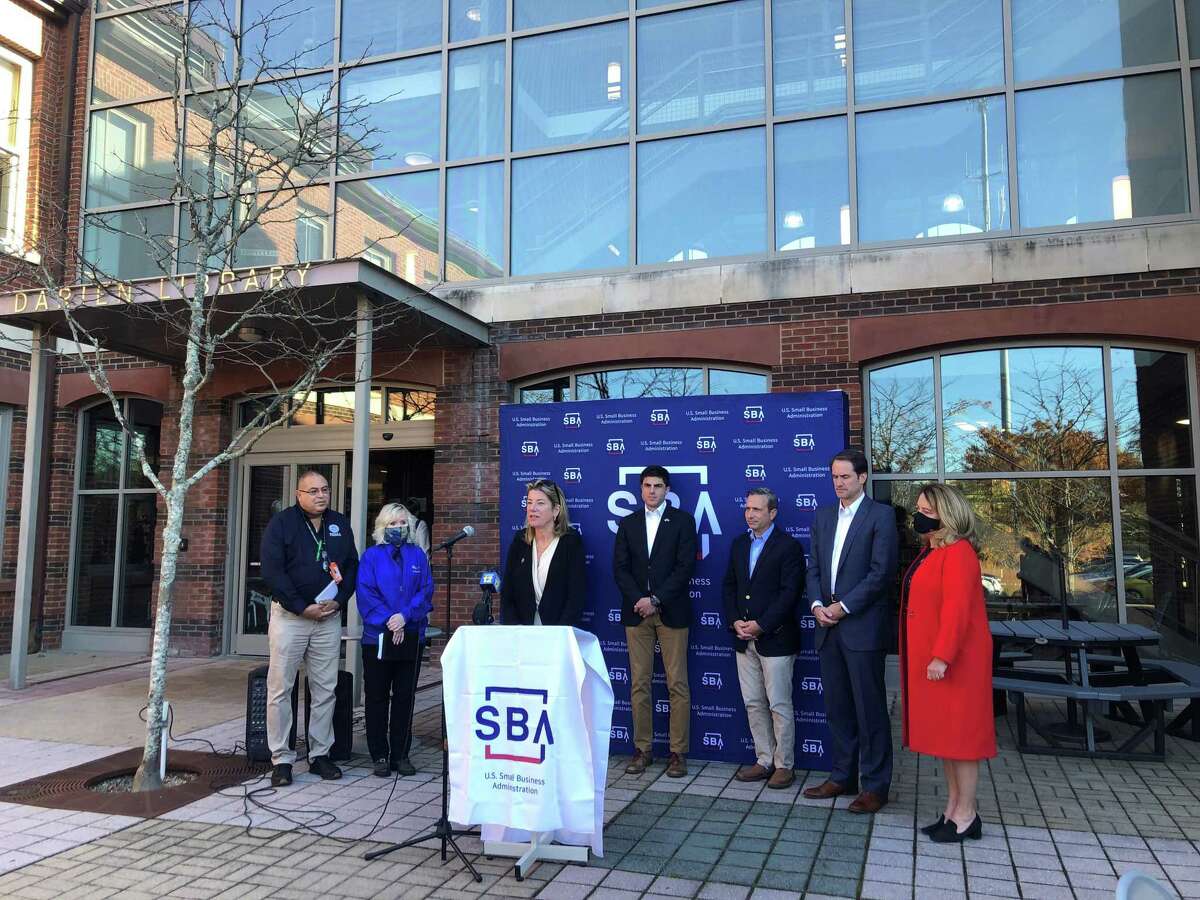 Town and federal officials gathered outside the Darien Library to announce the opening of a Business Recovery Center to help business owners apply for federal assistance after Hurricane Ida