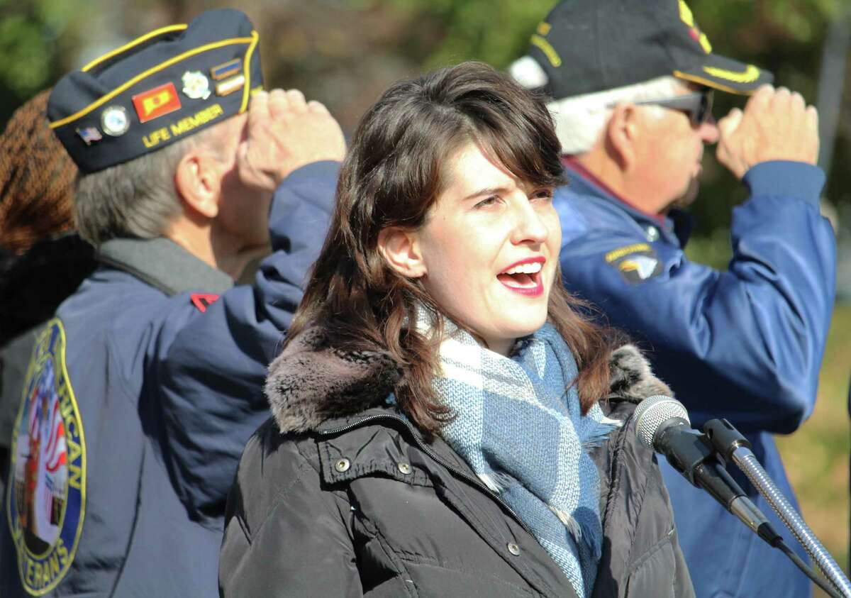 The Middletown Council of Veterans organized a Veterans Day observation Thursday morning at Veterans Green on Washington Street. The ceremony included the Middletown PBA band, five-gun salute and the playing of taps, and the presentation of a plaque on the occasion of the centennial of the Tomb of the Unknown Soldier. Here, Middletown High School graduate Allison Lindsay sings the National Anthem.