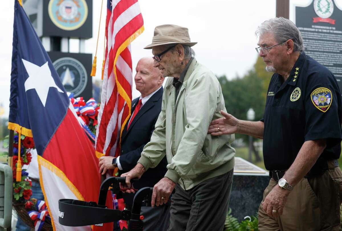 World War II veteran George Waters takes part in a Walk the Walk ceremony to honor the 100th anniversary of the Tomb of the Unkown Solider during a Veterans Day ceremony, Thursday, Nov. 11, 2021, in Conroe.