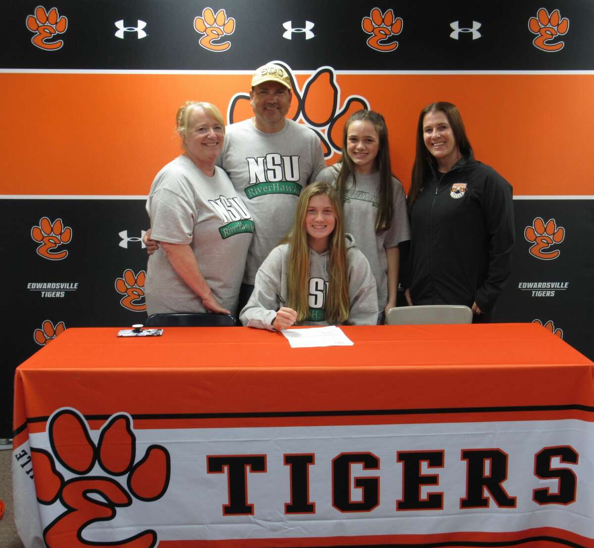 Jadyn Renth, seated center, was joined by her family and EHS girls soccer coach Abby Federmann as she signed to play soccer for Northeastern State University.