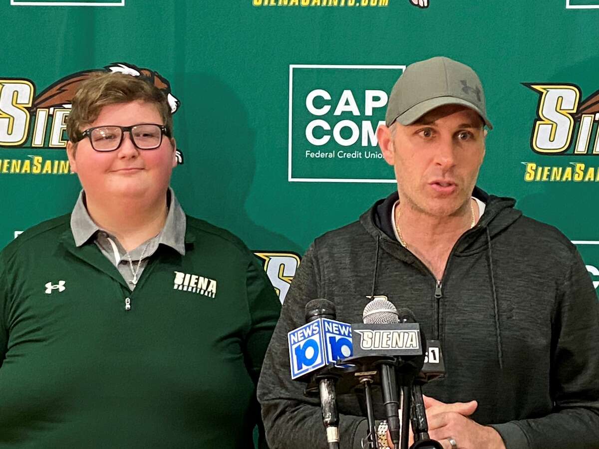 Evan Franz, a Tamarac High student, joined the Siena men's basketball team as an honorary member in 2021. Pictured here with head coach Carmen Maciariello, Franz died Monday after a long battle with brain cancer. (Mark Singelais/Times Union)