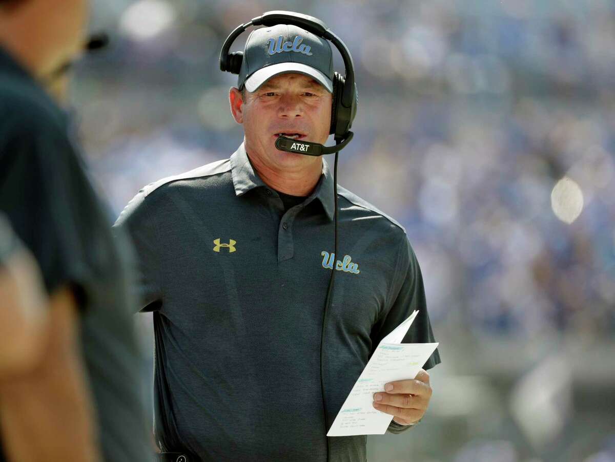UCLA head coach Jim Mora watches from the sideline during the first half of an NCAA college football game against Memphis Saturday, Sept. 16, 2017, in Memphis, Tenn. (AP Photo/Mark Humphrey)