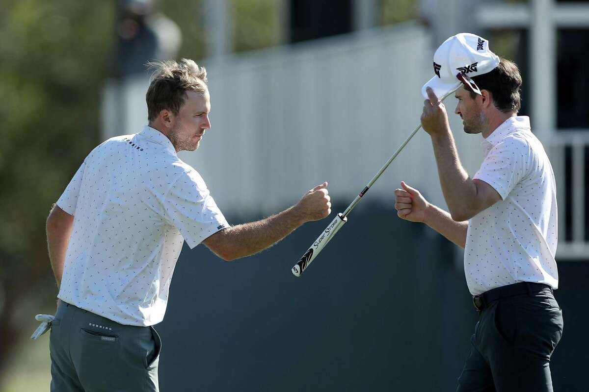 Russell Henley congratulates Kyle Stanley after the first round of the Hewlett Packard Enterprise Houston at Memorial Park Golf Course on Thursday, November 11, 2021.