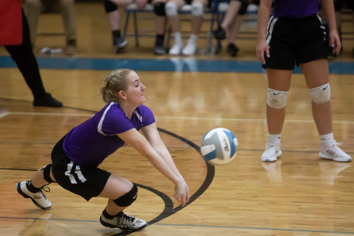 Calvary Baptist's Emma Schmidt bumps the ball during a match in 2021.