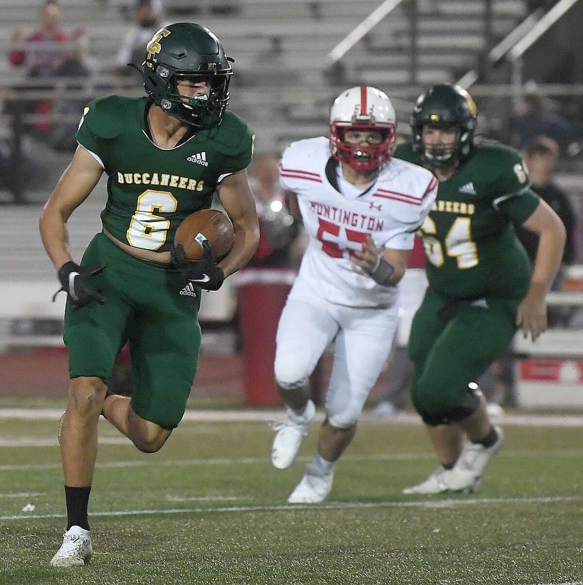 East Chambers' Haydn Reeves sprints downfield to bring in the first touchdown during their playoff match-up against Huntington Thursday in Lumberton. Photo made Thursday, November 11, 2021 Kim Brent/The Enterprise