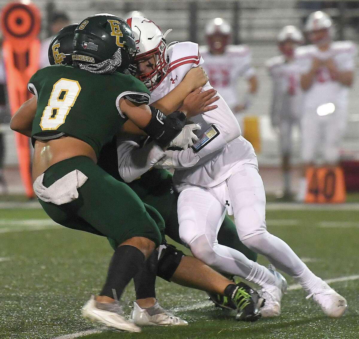 East Chambers' Cooper McKay helps put an end to the offensive push during their playoff match-up against Huntington Thursday in Lumberton. Photo made Thursday, November 11, 2021 Kim Brent/The Enterprise