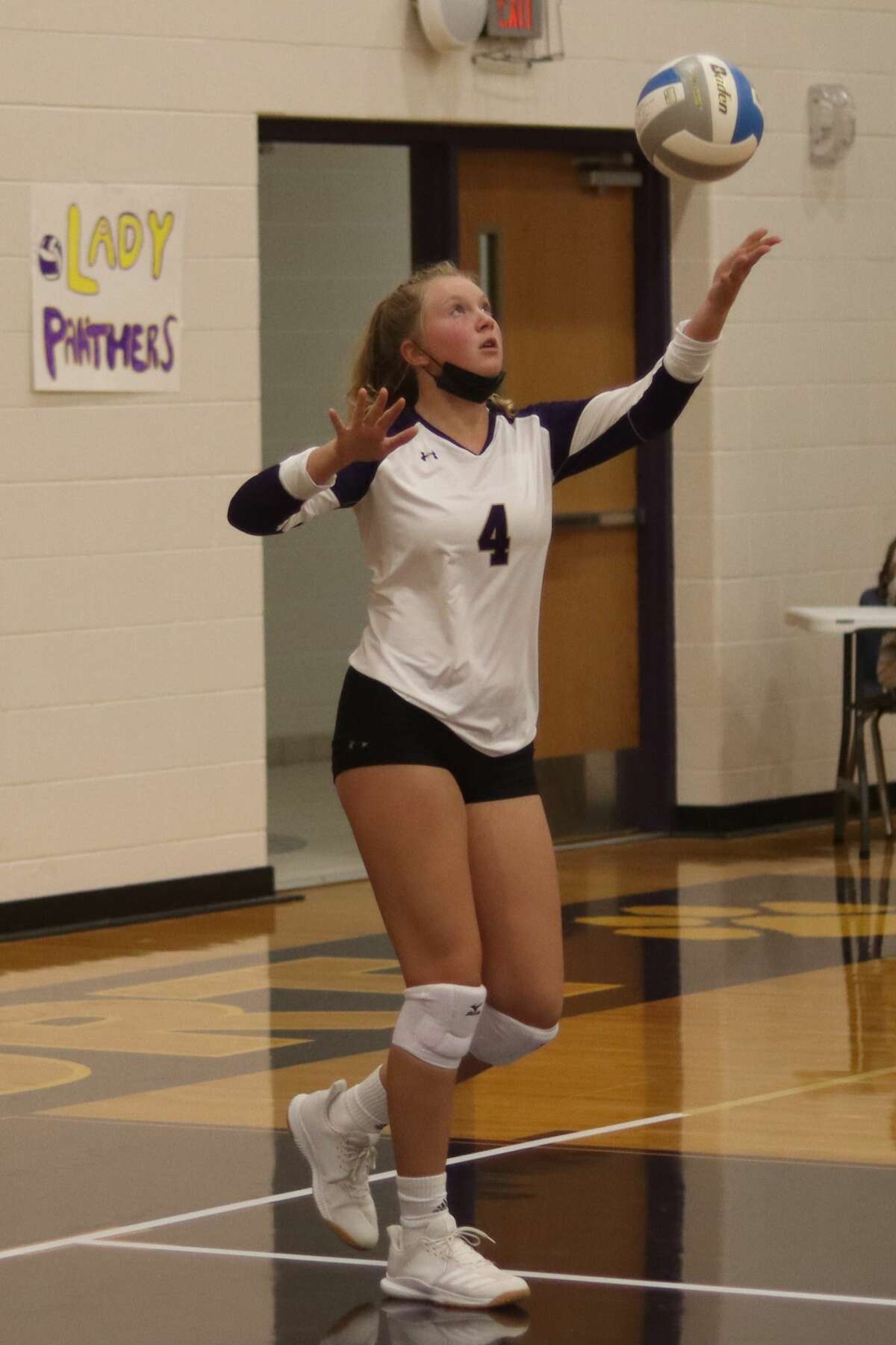 Payton Miller serves the ball for the Panthers during a game this fall. 