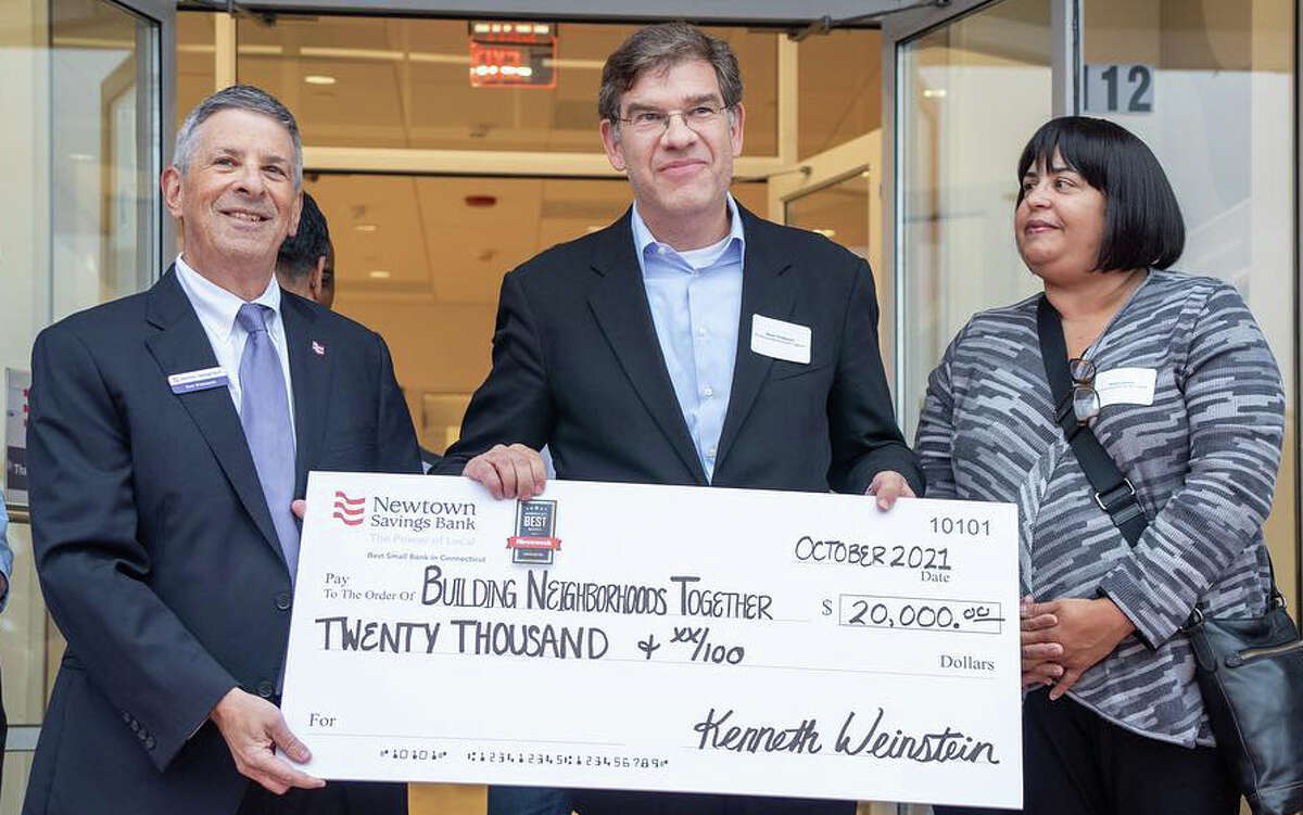 Newtown Savings Bank presents $20,000 donation to Building Neighborhoods Together (BNT) for affordable housing initiatives. Photo By Newtown Savings Bank. Pictured L-R: Ken Weinstein (President & CEO Newtown Savings Bank), Noah Gotbaum (BNT CEO), Doris Latorre (BNT Deputy Director)