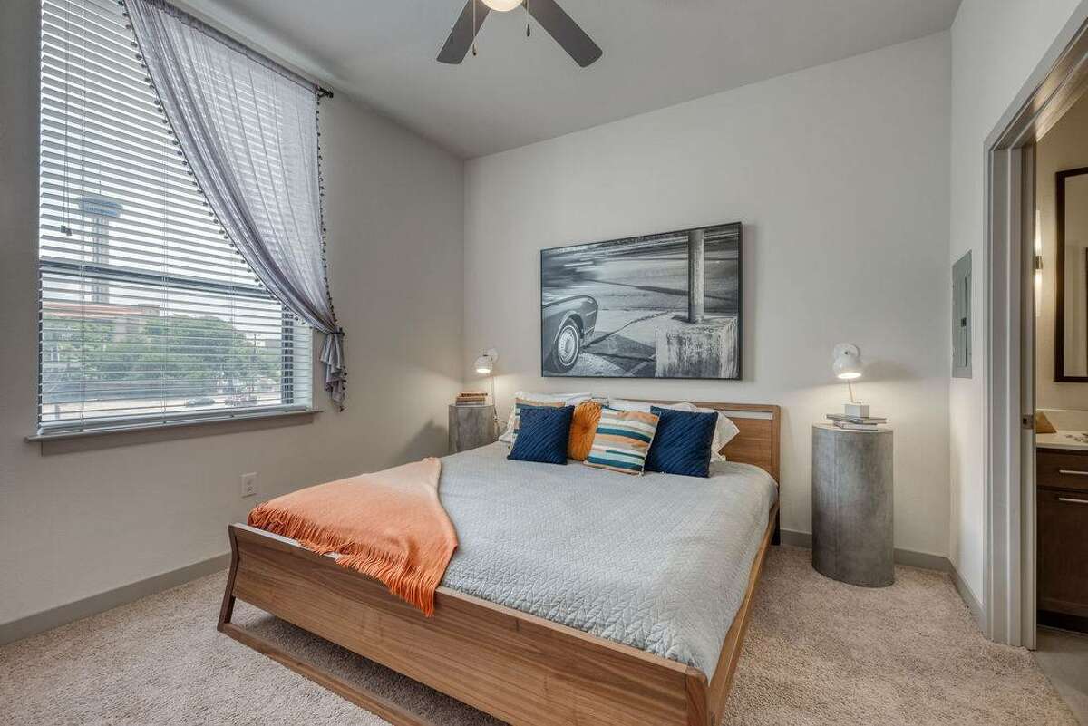 One of the bedrooms in this unit has window with a view of downtown San Antonio.