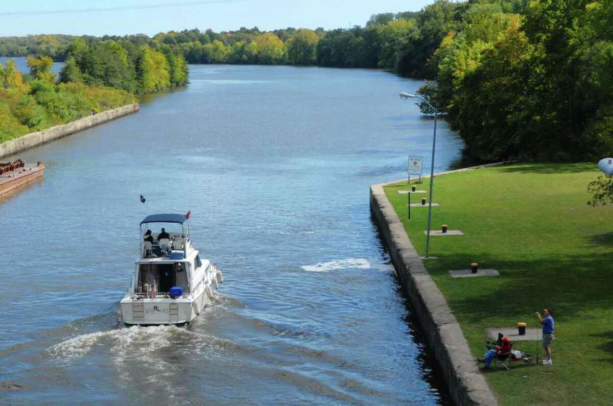 A boat is piloted out of Lock 7, heading east on the Erie Canal in Niskayuna, NY on Monday, Sept. 20, 2010. (Paul Buckowski / Times Union)