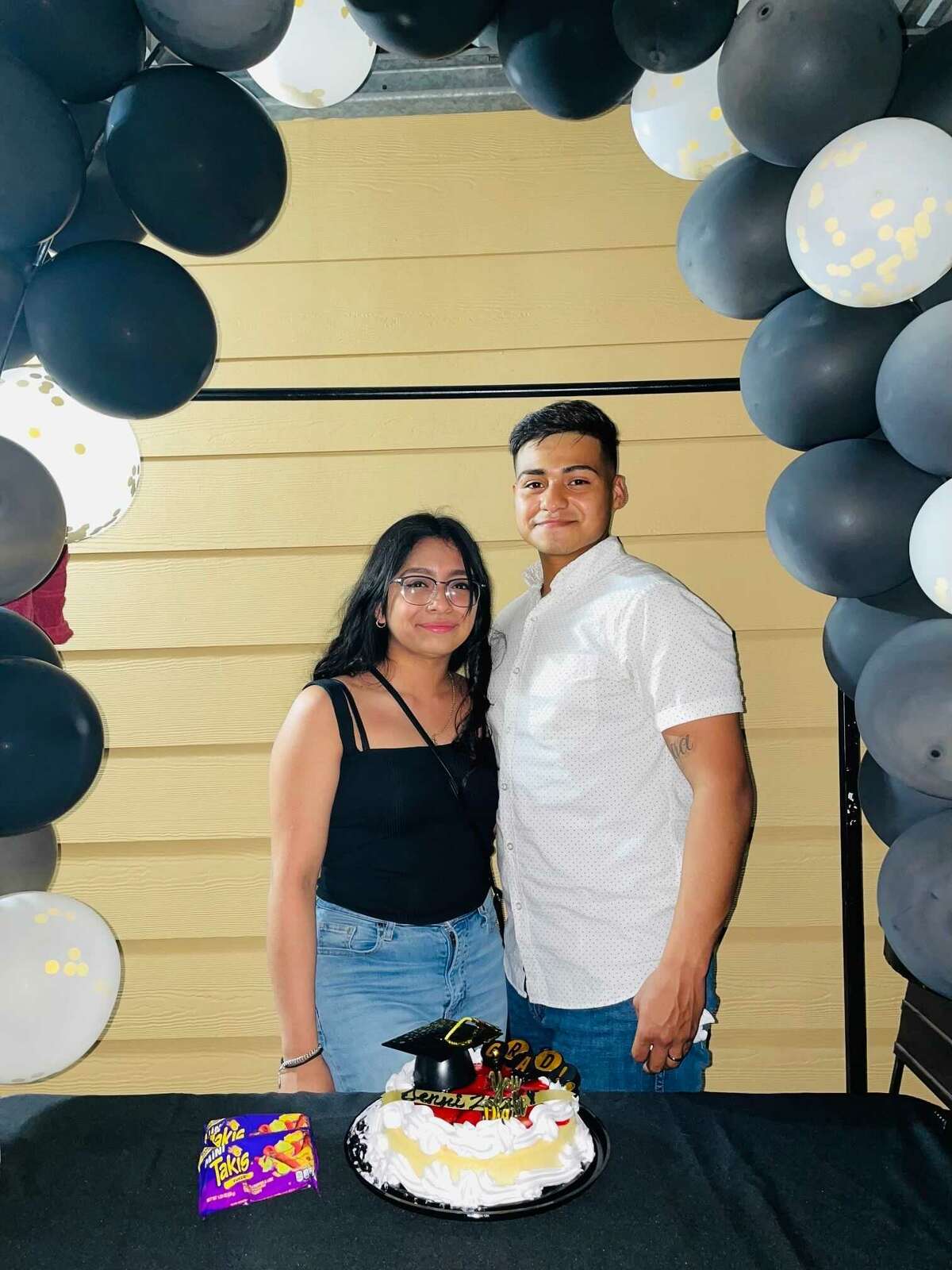 Jennifer Gomez and Jerson Barrondo at a surprise party for Gomez after her graduation from Prairie View A&M University, May 15, 2021.