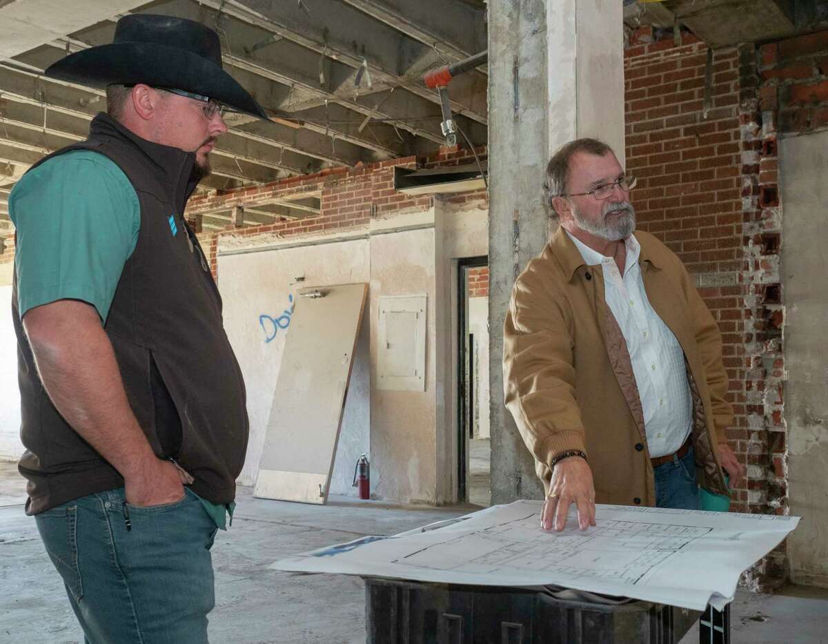 Pat Brown, right, President of Thriving United and his contractor, builder and designer, Charlie Lewis, with BBC Builders LLC, talk about the plans and design of the old Midland Reporter-Telegram building that has been gutted and prepped for new use as community center for Thriving United. 11/12/2021 Tim Fischer/Reporter-Telegram