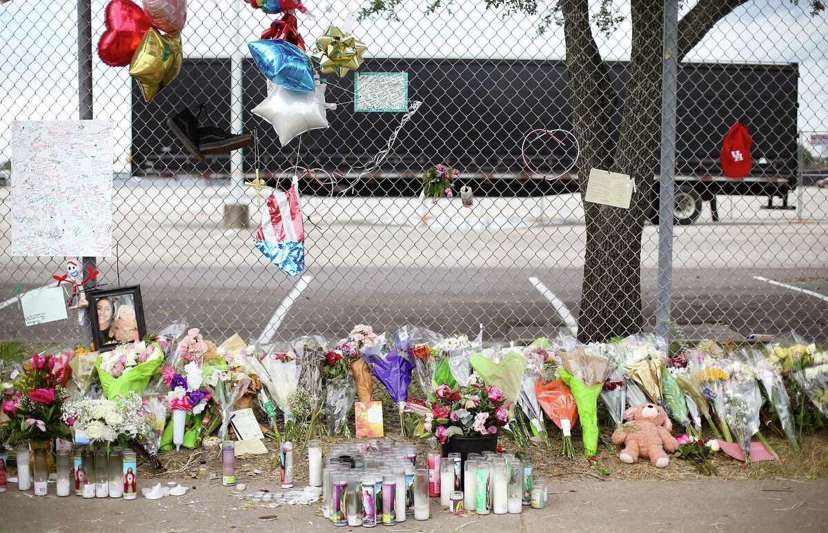 Flowers, balloons and candles line a makeshift memorial at Westridge and Kirby, in honor of the victims of the tragedy at the Astroworld Festival on Tuesday, Nov. 9, 2021, in Houston.