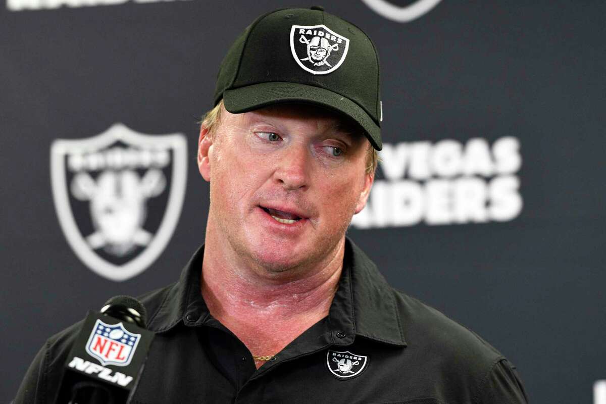 FILE - Las Vegas Raiders head coach Jon Gruden speaks with the media following an NFL football game against the Pittsburgh Steelers in Pittsburgh on Sept. 19, 2021. The former Raiders coach has sued commissioner Roger Goodell and the NFL, alleging that a "malicious and orchestrated campaign" was used to destroy his career by leaking old offensive emails from him. The suit was filed in district court in Clark County, Nev., on Thursday, Nov. 11, 2021, exactly a month after Gruden resigned as Raiders coach following the publication of his emails by the Wall Street Journal and New York Times.
