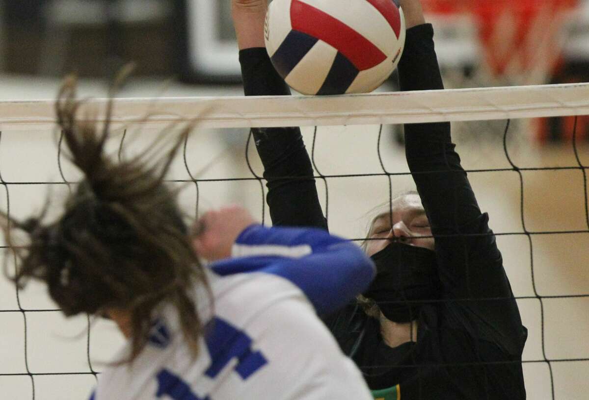 Brown County's Grace Hedden blocks a spike during a match this season.