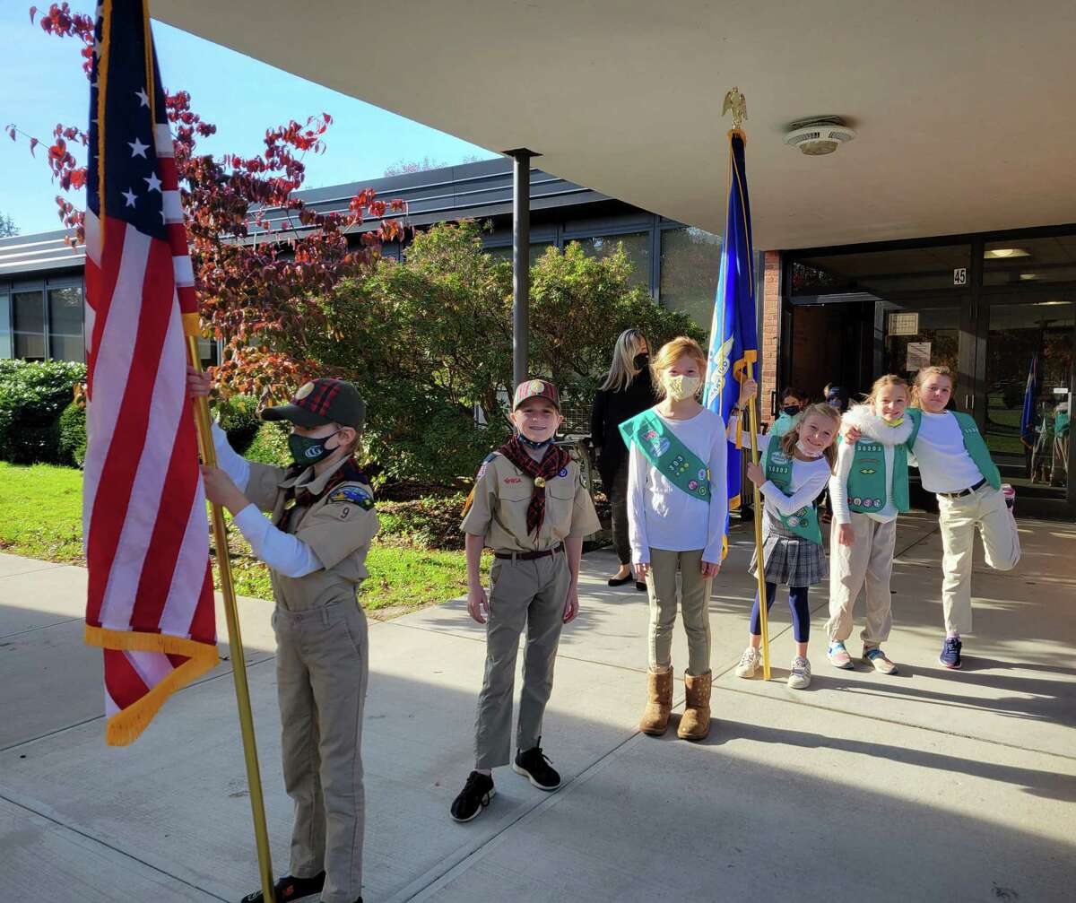 Scouts Abby Winig, Caroline Collins, Campbell and Evie Kelly, Knox Williams, and Maisy Young take part in a Veterans Day ceremony on Thursday, Nov. 11, 2021, at North Street School in Greenwich
