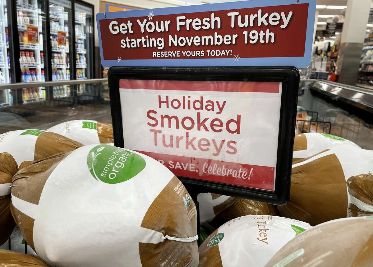 Smoked turkeys are displayed for sale in a grocery store ahead of the Thanksgiving holiday on November 11, 2021 in Los Angeles, California. (Photo by Mario Tama/Getty Images)