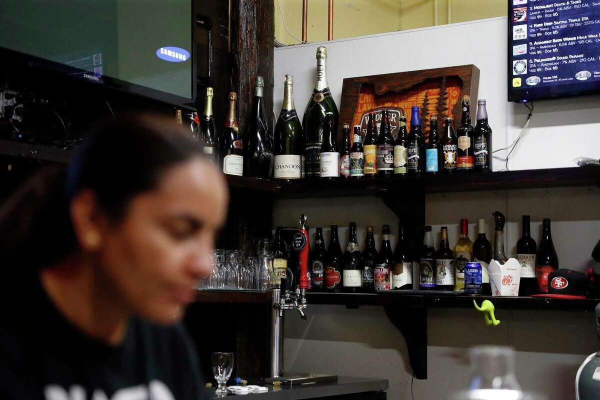 Sandy Kaur tends bar at Bottles Beerzaar in El Sobrante.