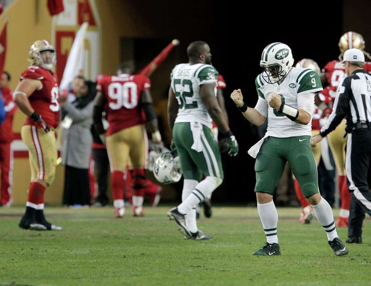 Bryce Petty (9) celebrates after Bilal Powell (29) scored the game-winning touchdown in the overtime period as the San Francisco 49ers played the New York Jets at Levi's Stadium in Santa Clara, Calif., on Sunday, December 11, 2016. The Jets won in 23-17 overtime.