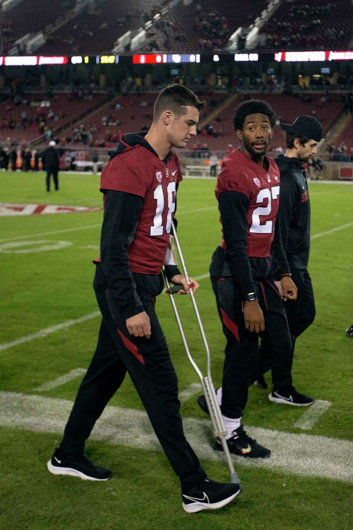 Stanford quarterback Tanner McKee (18) walks with the aid of a crutch before the team's NCAA college football game against Utah, Friday, Nov. 5, 2021, in Stanford, Calif. (AP Photo/D. Ross Cameron)
