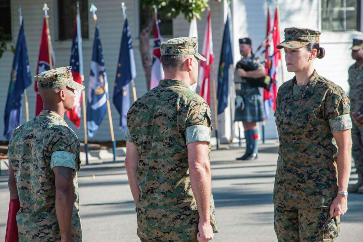 Brodersen stands at attention during her retirement ceremony at 1st Marine Division at Camp Pendleton, CA. The person directly in front of her is Col. Stephen Manber, the retiring officer.
