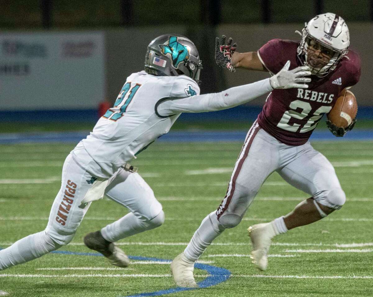 Legacy High's Makhilyn Young gets past Pebble Hills' Jose Olazaba on his way to a touchdown 11/12/2021 at Grande Communications Stadium Tim Fischer/Reporter-Telegram
