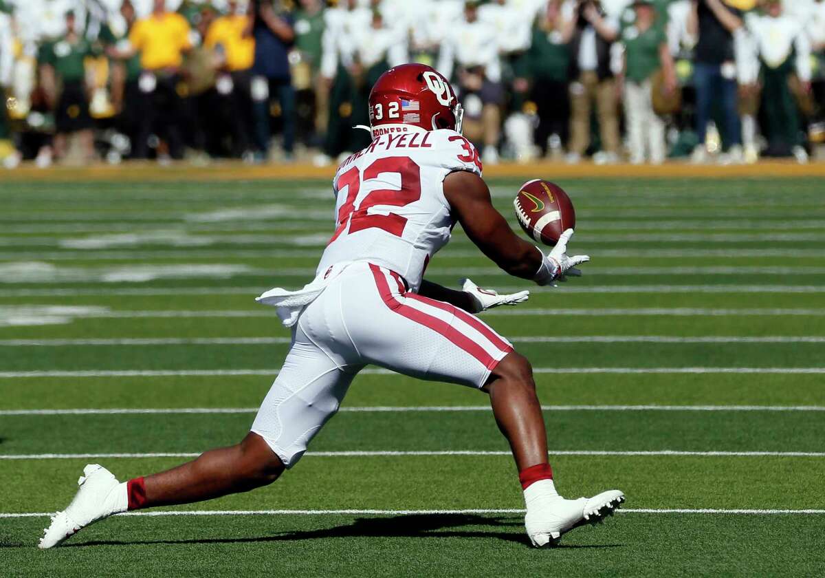 Oklahoma safety Delarrin Turner-Yell makes an interception against Baylor during the first half of an NCAA college football game in Waco, Texas, Saturday, Nov. 13, 2021.