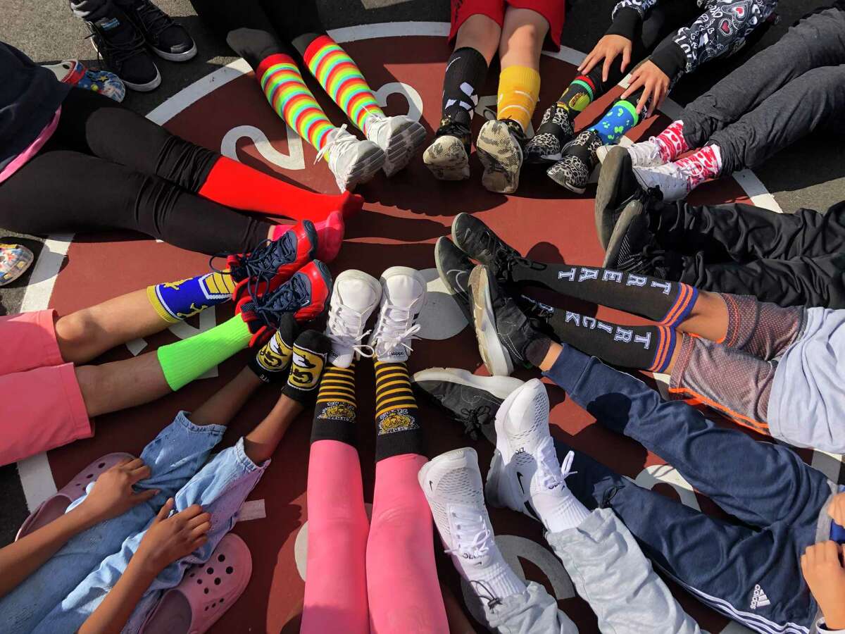 Members of the fifth grade at Westover School collected more than 2,440 pairs of socks in October for local agencies that help needy people.
