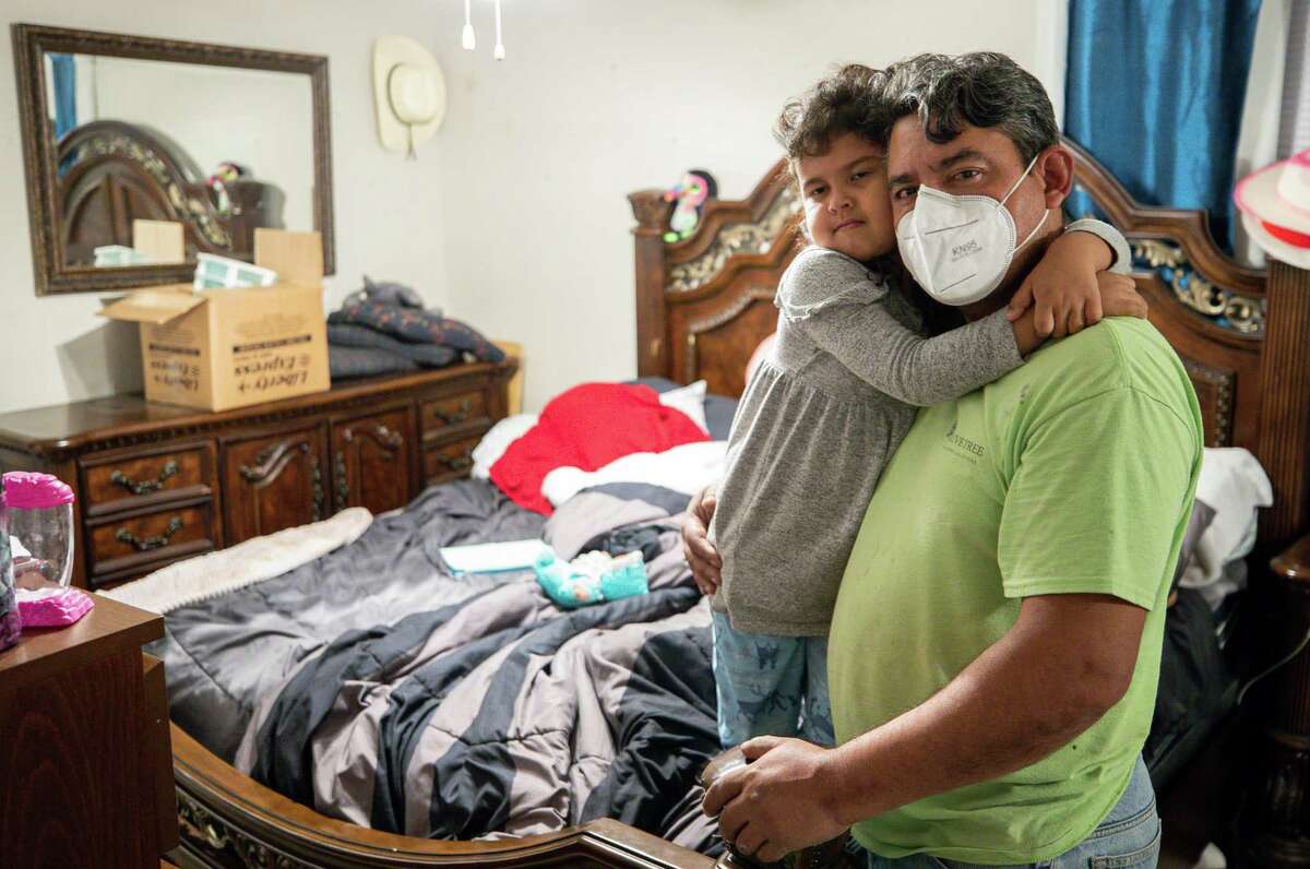 Jaider Vera and his five-year-old daughter Alexandria inside their bedroom at Villas Del Paseo apartment complex on Wednesday, March 17, 2021, in Houston. A month after the winter storm knocked out power and burst water pipes across the state, many renters are still living with the damage and realizing that renter protections are especially weak in Texas. Vera has water seeping out of one of his walls, and mold is spreading through the bedroom walls. When he asked management to allow him to switch to another apartment or release him from his lease, they denied the request.